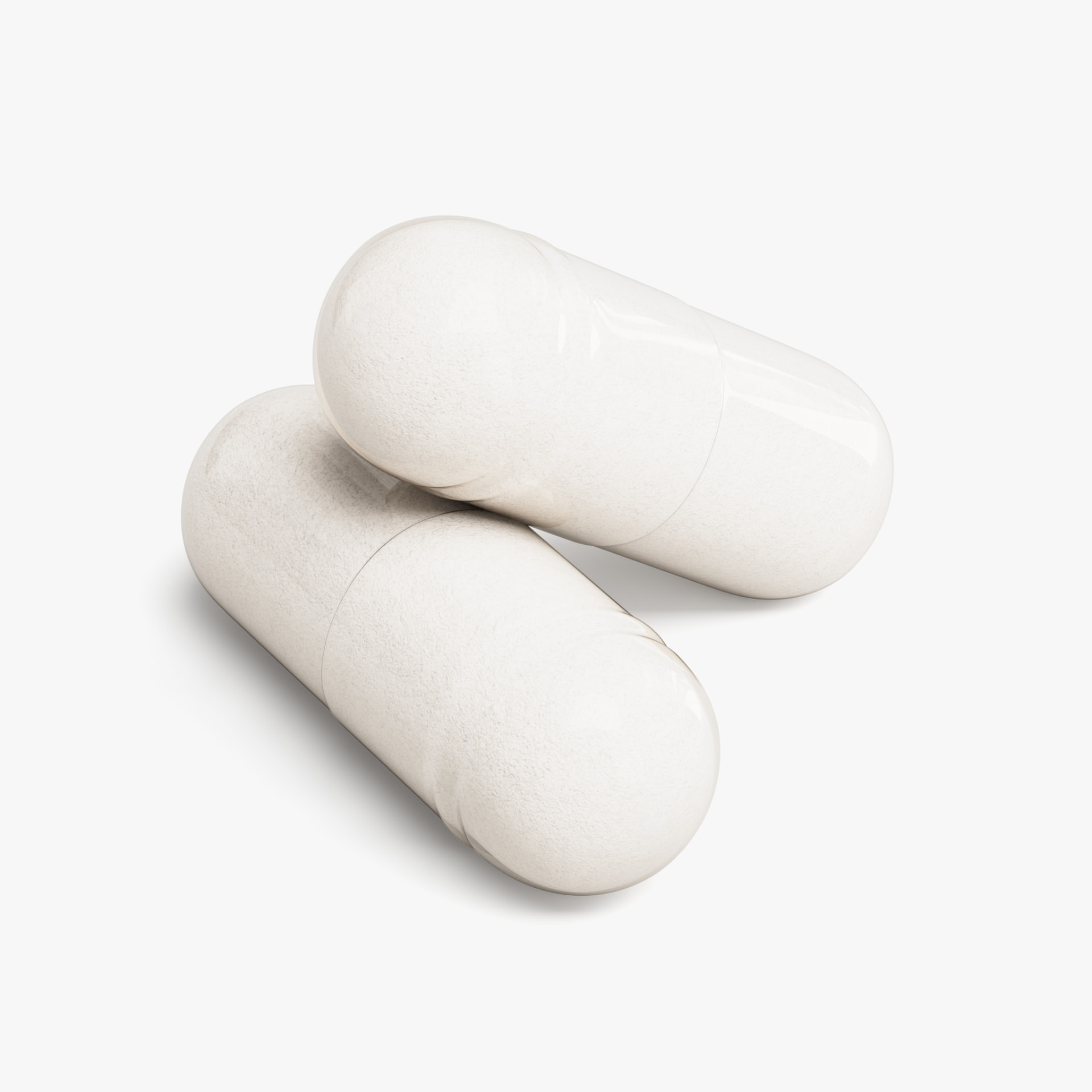 Two white Serni Magnesium Glycinate capsules close-up — chelated, highly absorbable